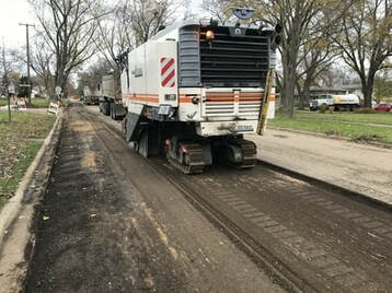 Geske & Sons milling crew preparing a road for asphalt paving in Woodstock, IL
