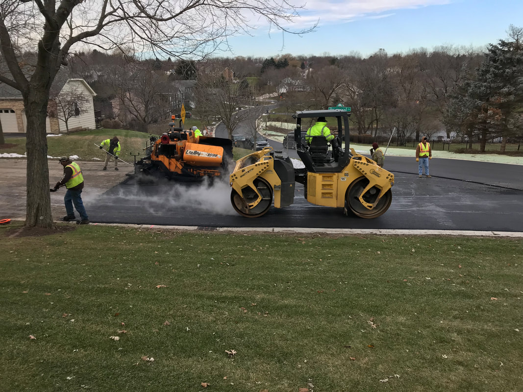 The Geske & Sons paving crew laying asphalt 